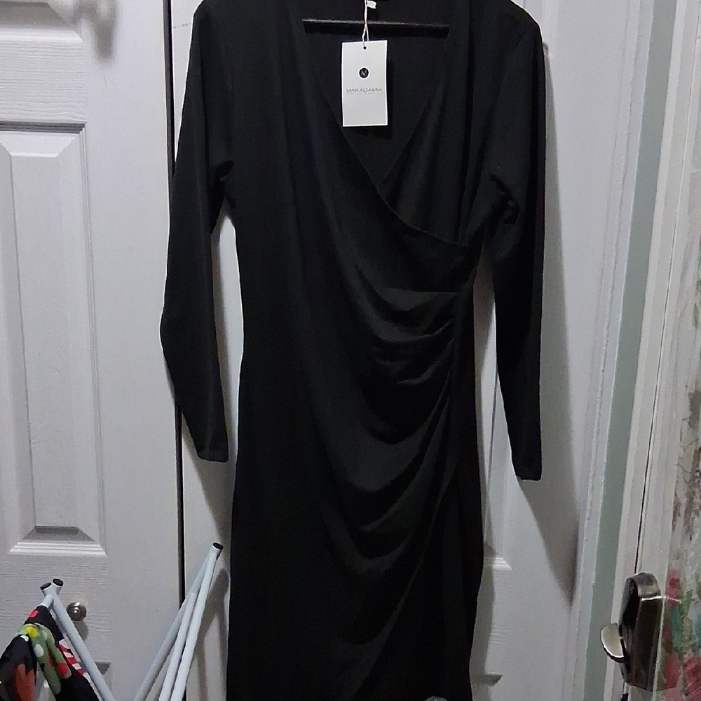 Swiss Made, New With Tags.Elegant Black Long Sleeve Dress
